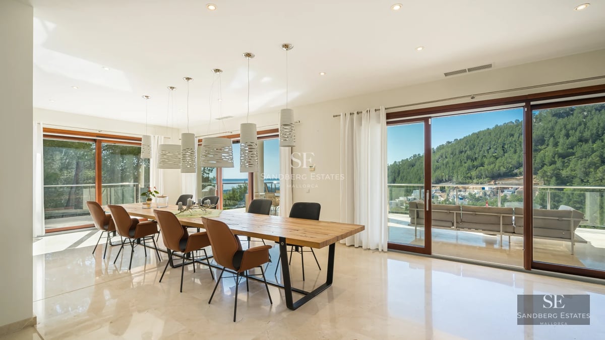 Exterior view of a modern villa with infinity pool. Minimalist design, large windows, spacious terrace and manicured garden.