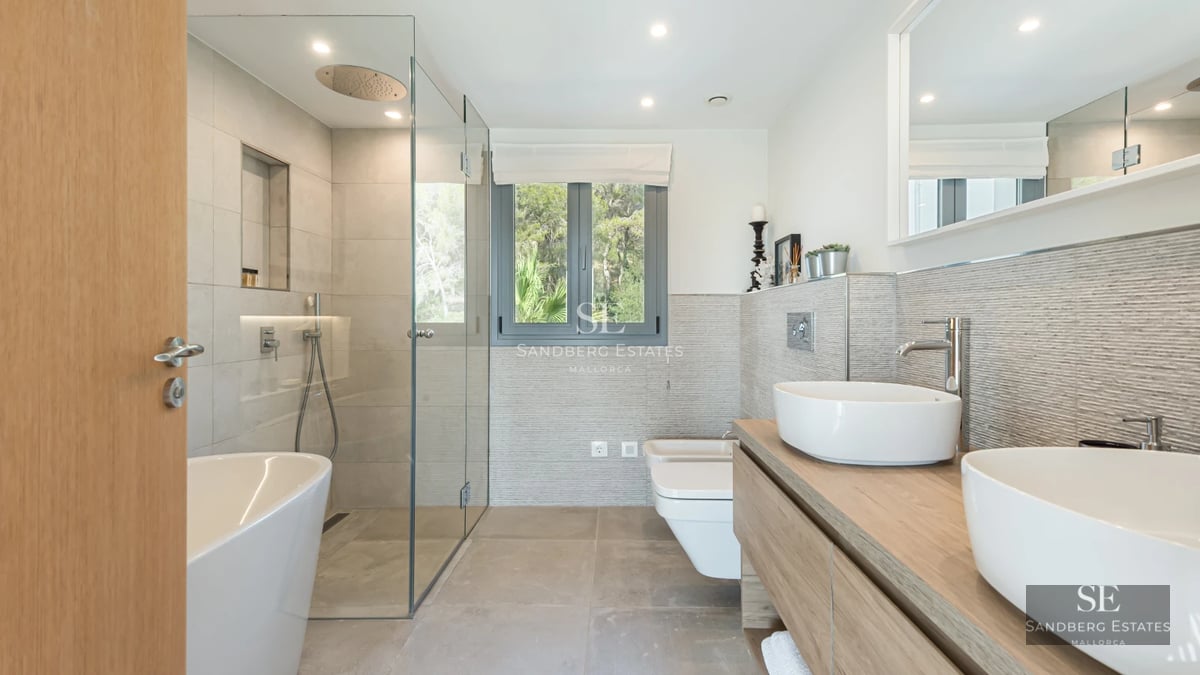 Aerial view of a modern villa featuring a swimming pool, lush garden, and minimalist architecture. Luxury and design at its finest.