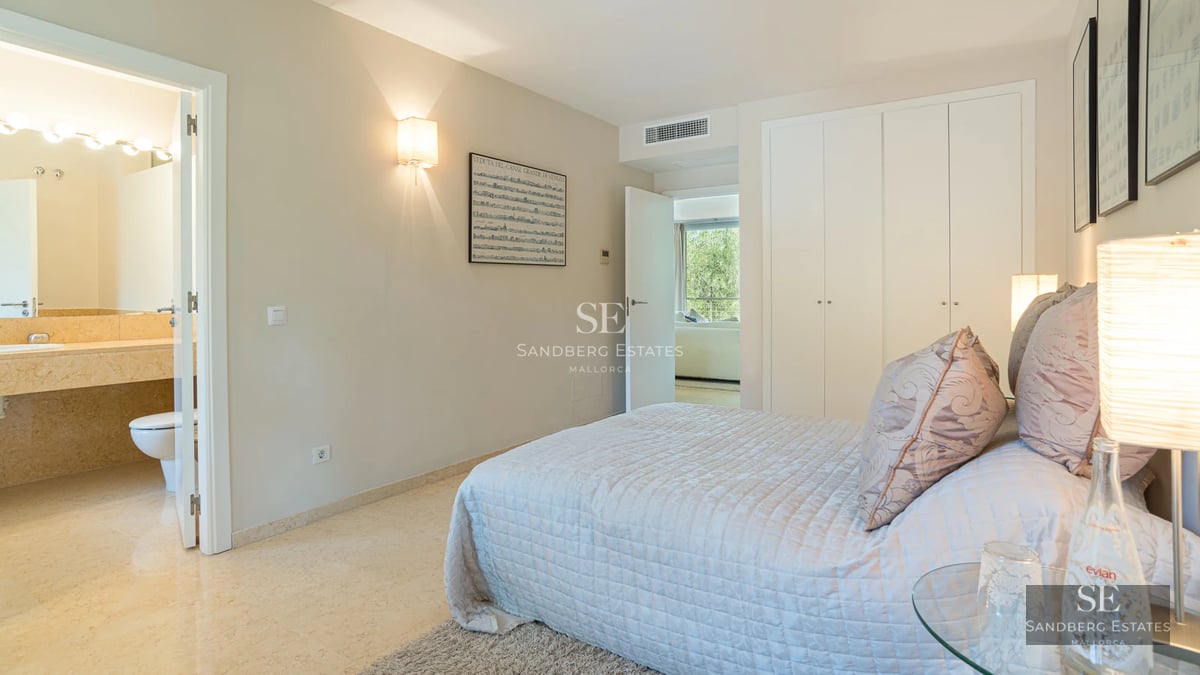 Exterior view of a modern villa with pool, surrounded by lush gardens. Elegant architecture featuring large windows and spacious terraces.