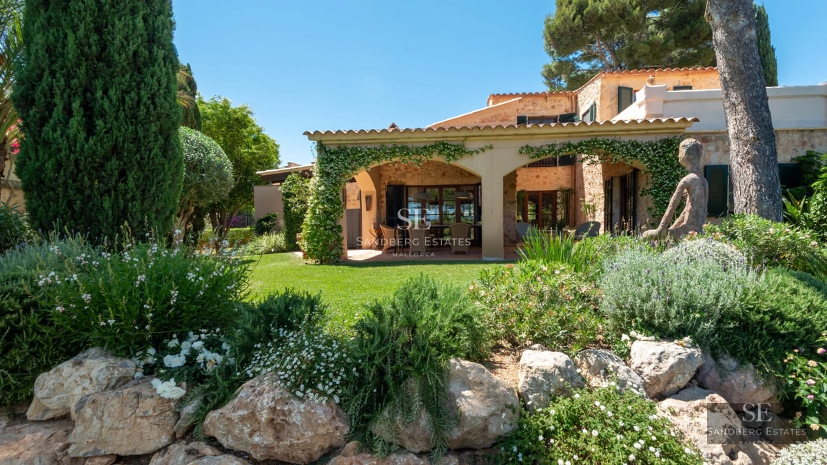 Spacious living room with panoramic windows, modern fireplace, and minimalist decor. Expansive views, abundant natural light.