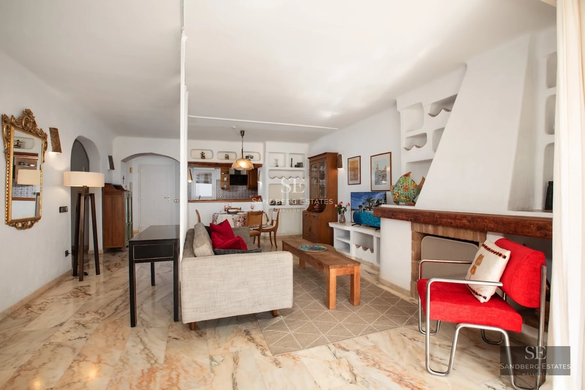 Spacious balcony with sea view. Modern design, glass railing and comfortable outdoor furniture. Soft ambient lighting.