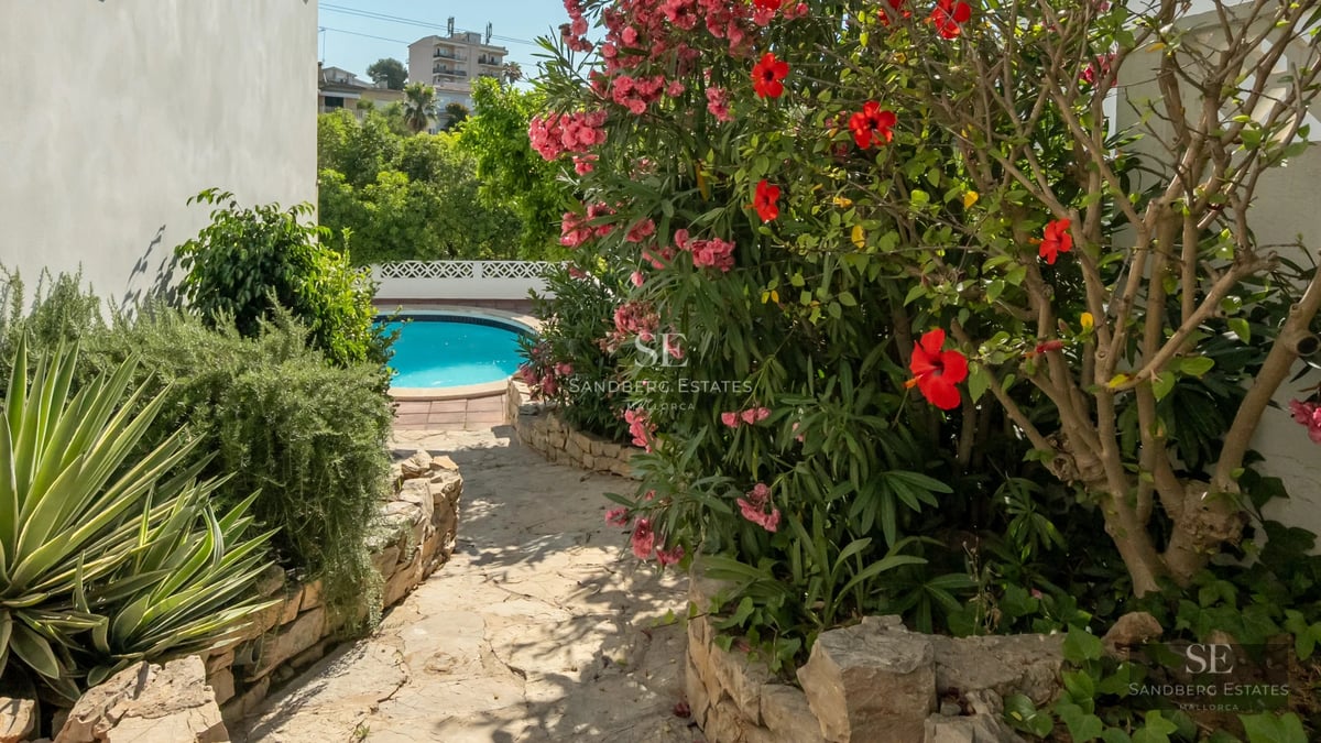 Spacious balcony with sea view. Modern design with glass railing and wooden floor. Ideal for relaxing and enjoying the scenery.