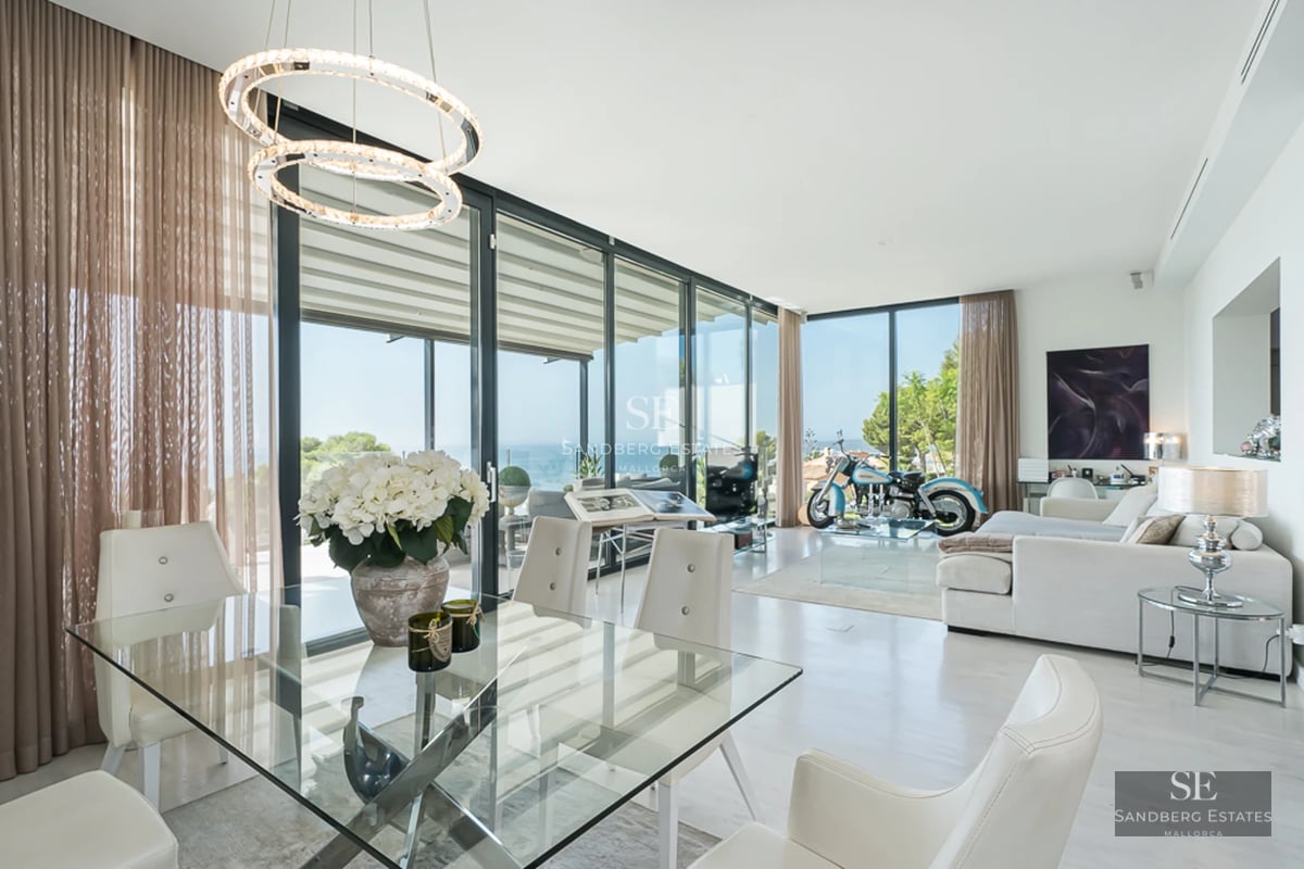 Stunning view of a modern villa with reflecting pool, manicured lawn, and minimalist architecture. Perfect balance of luxury and tranquility.