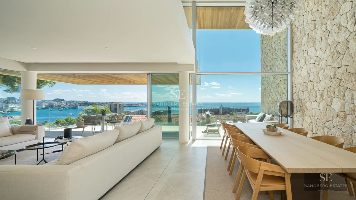 Exterior view of a modern villa with a pool, lush garden, and minimalist architecture. Elegant design and luxurious finishes.