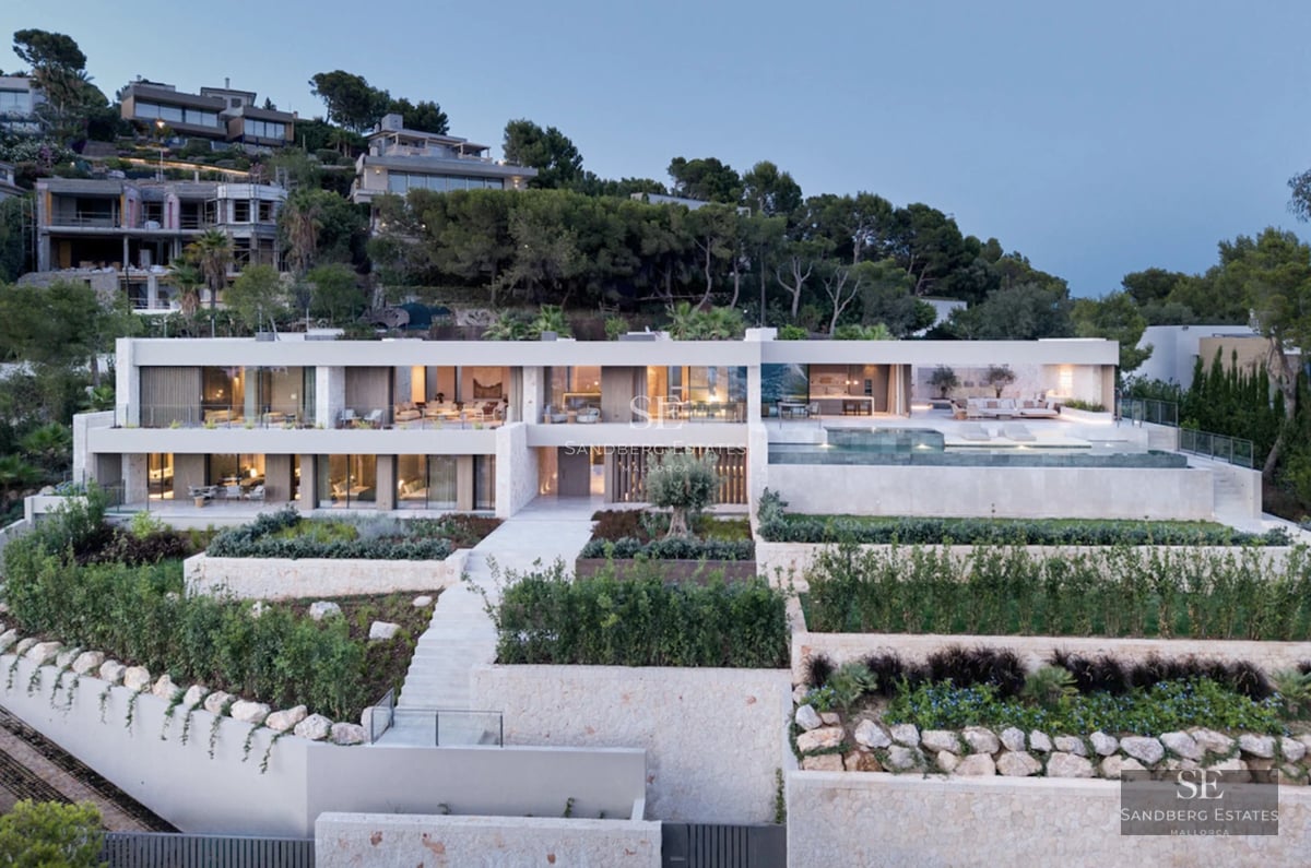 Expansive terrace with infinity pool, elegant lounge chairs, and panoramic views. Modern design with clean lines and luxury finishes.