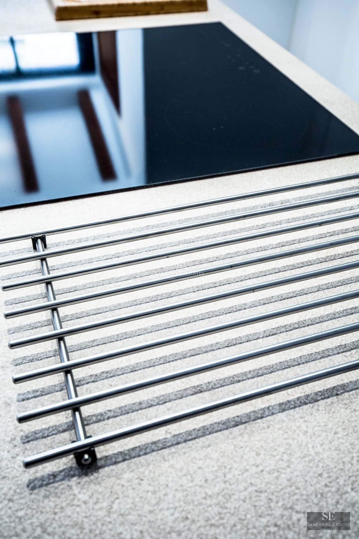 Expansive terrace with pool, modern furniture, and unobstructed views. Sleek, minimalist architecture.