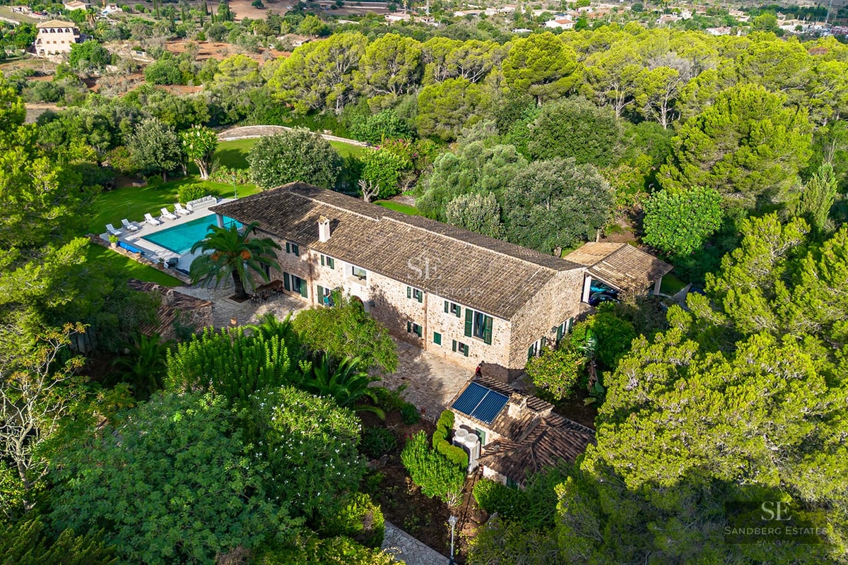 Ground-level view of an infinity pool with ocean views. Modern architecture, turquoise water, and relaxing setting.