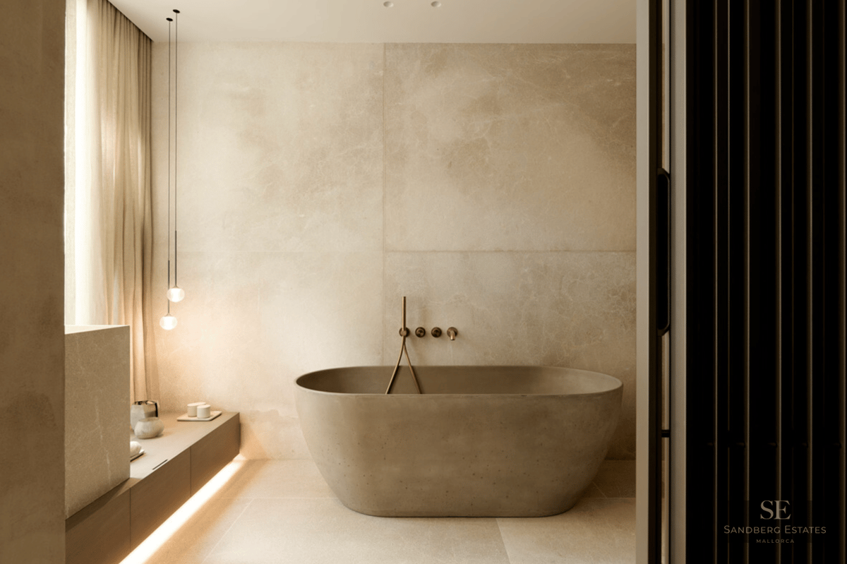 A luxury minimalist bathroom featuring a freestanding stone bathtub, travertine walls, and soft ambient lighting.