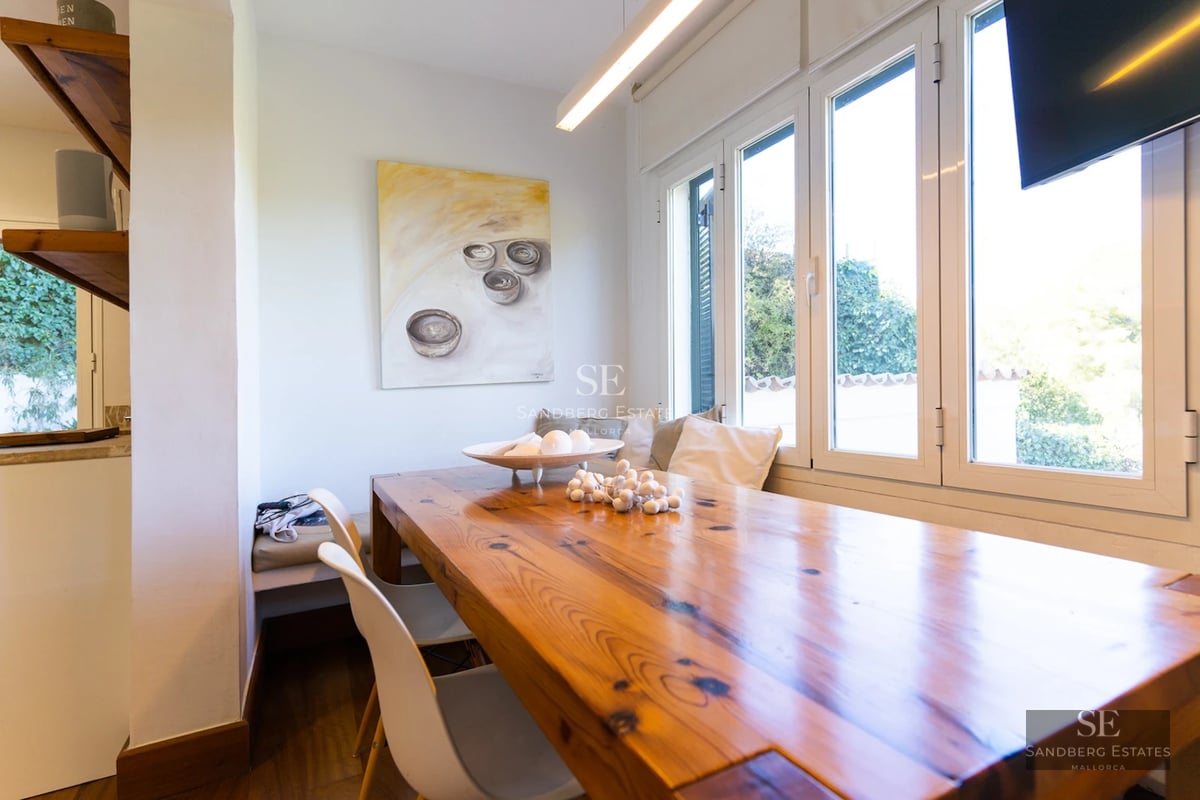 Expansive terrace with infinity pool and panoramic views. Modern architecture with clean lines and large windows.