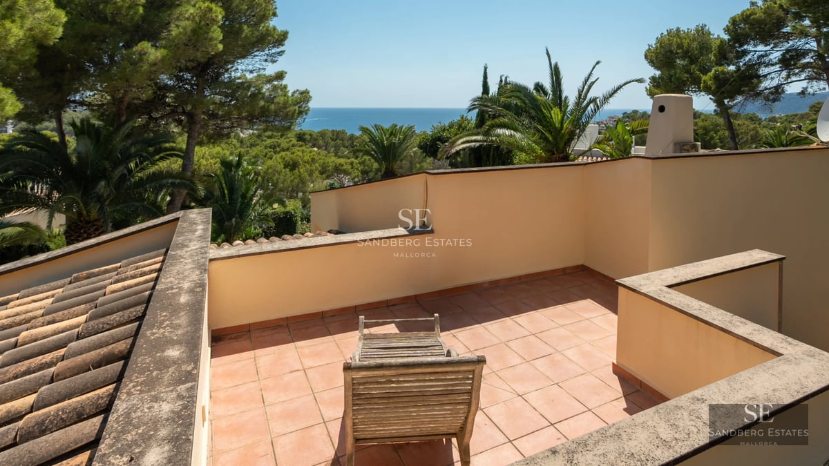 Expansive terrace with infinity pool. Modern architecture with clean lines and large windows. Minimalist design and panoramic views.