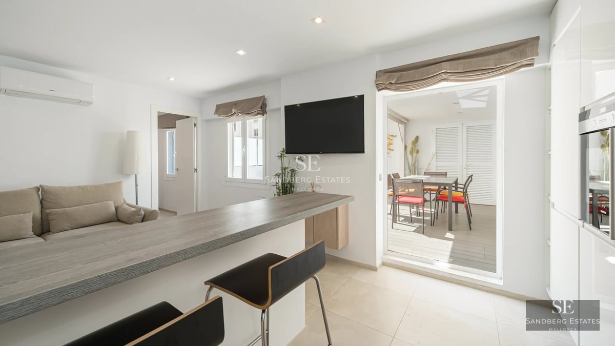 Exterior view of a luxurious property with infinity pool, manicured garden, and modern architecture. Warm sunset lighting.