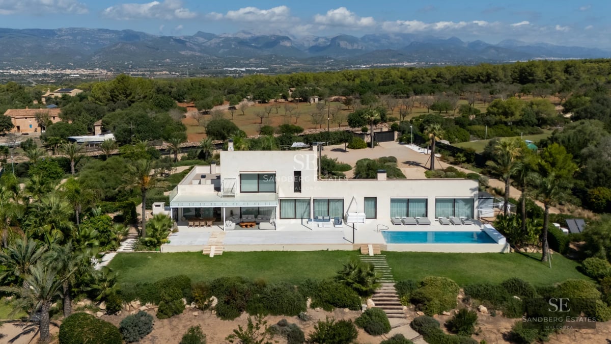 Spacious balcony with panoramic sea views. Modern design with stylish outdoor furniture and glass railing.