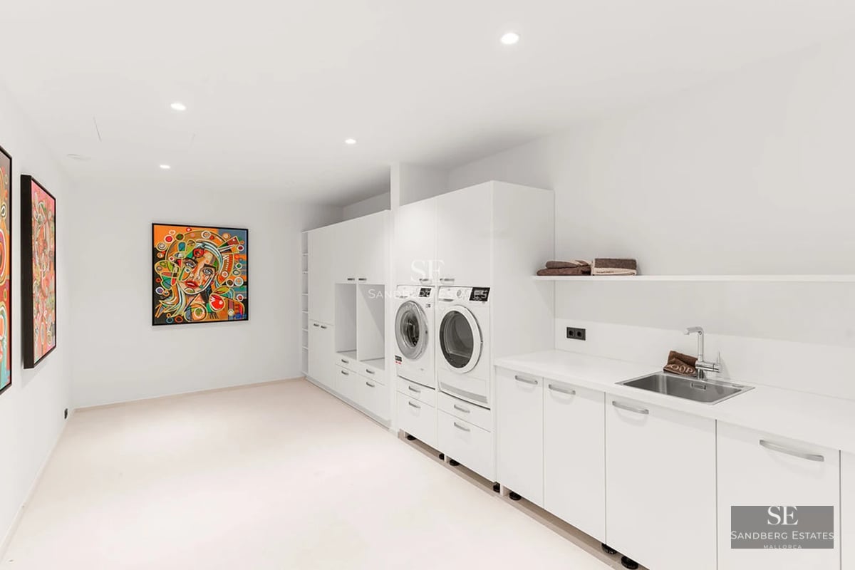 Exterior view of a modern villa with a reflecting pool, stylish furniture, and lush garden. Minimalist architecture.