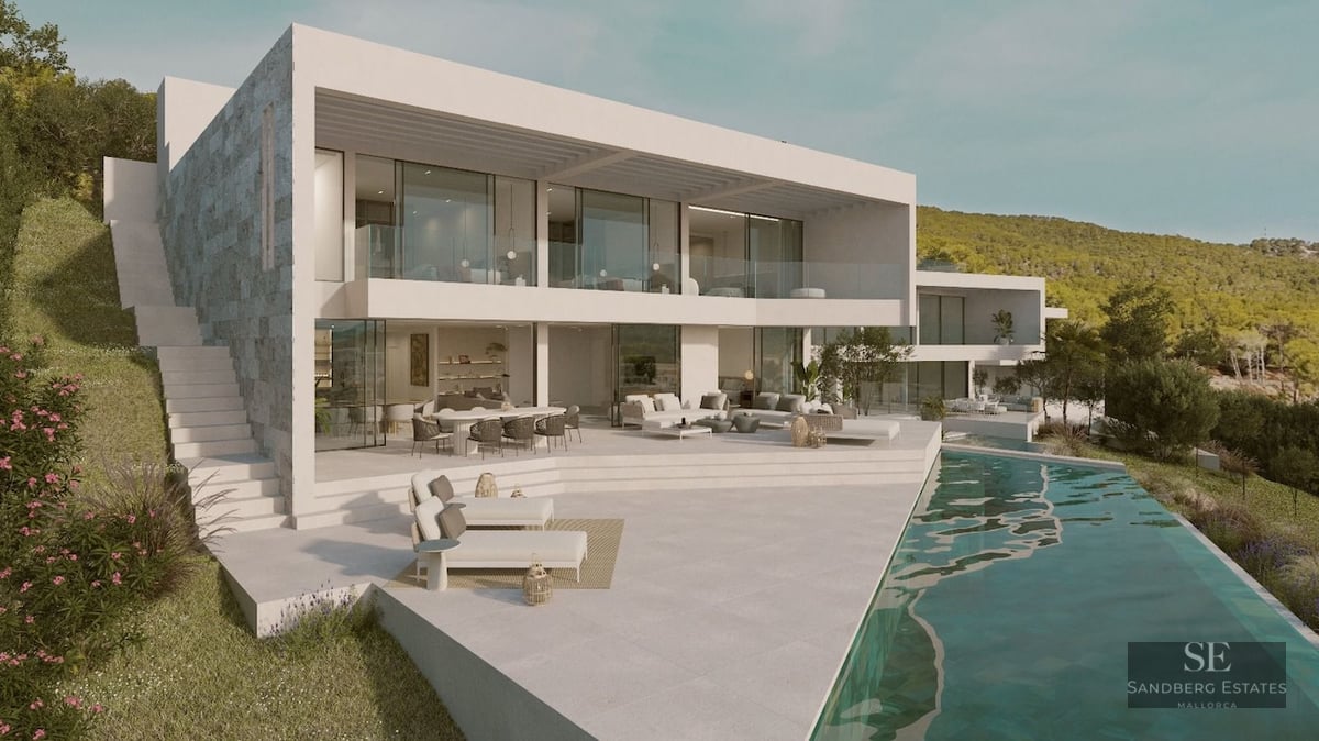Modern white multi-level villa with a long infinity pool and large terrace overlooking a lush green hillside.