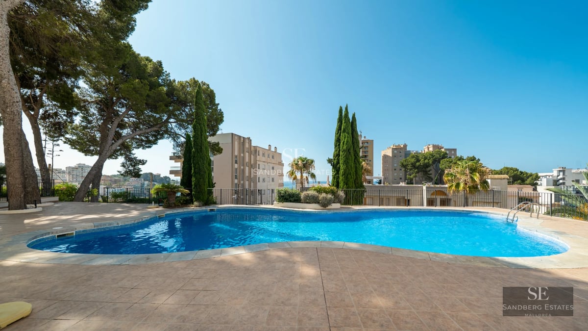 Expansive terrace features an infinity pool, sun loungers, panoramic views and elegant outdoor furniture.