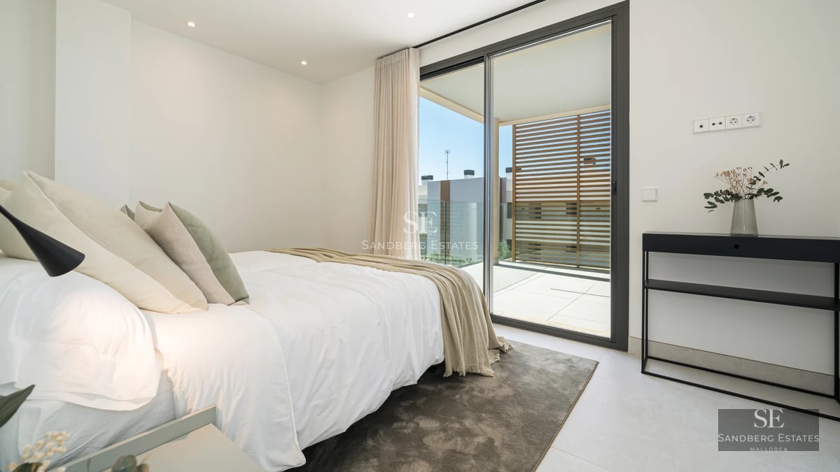 Expansive terrace with infinity pool, sun loungers, and sea views. Modern design featuring high-quality materials and abundant natural light.