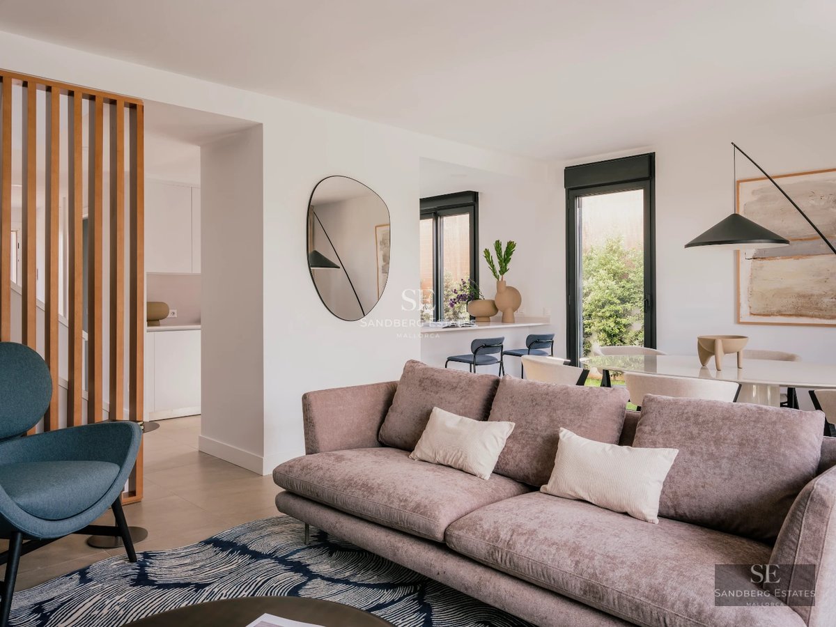 Exterior view of a modern villa featuring an infinity pool, lush garden, and spacious terraces. Contemporary and elegant architecture.