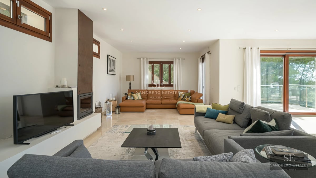 Spacious balcony with panoramic sea views. Elegant outdoor furniture. Modern design with abundant natural light.