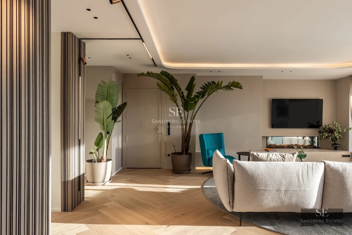 Spacious living room featuring floor-to-ceiling windows, light wood floors, modern fireplace, and access to a terrace with a pool. Minimalist, elegant design.