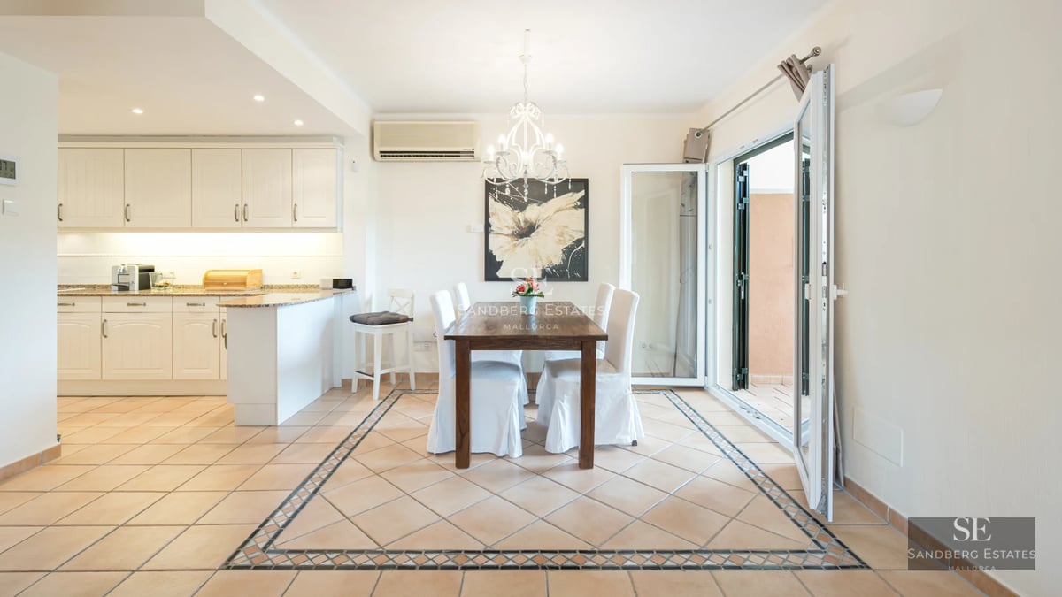 Expansive terrace with infinity pool. Panoramic sea views. Modern design with elegant outdoor furniture and lush vegetation.