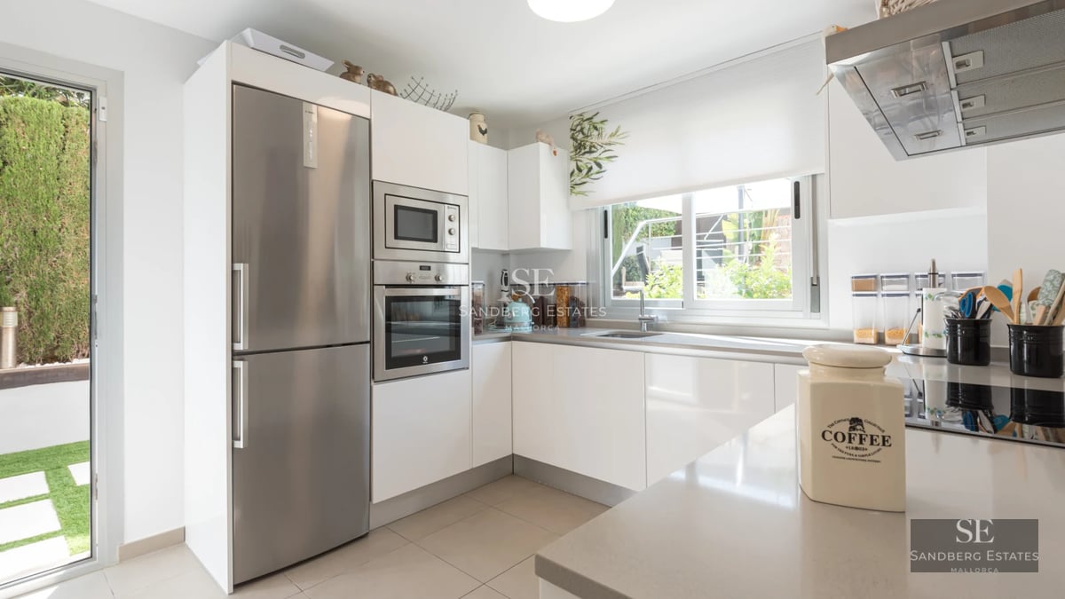 Exterior view of a modern villa with pool, expansive terraces, and minimalist architectural design. Soft ambient lighting.