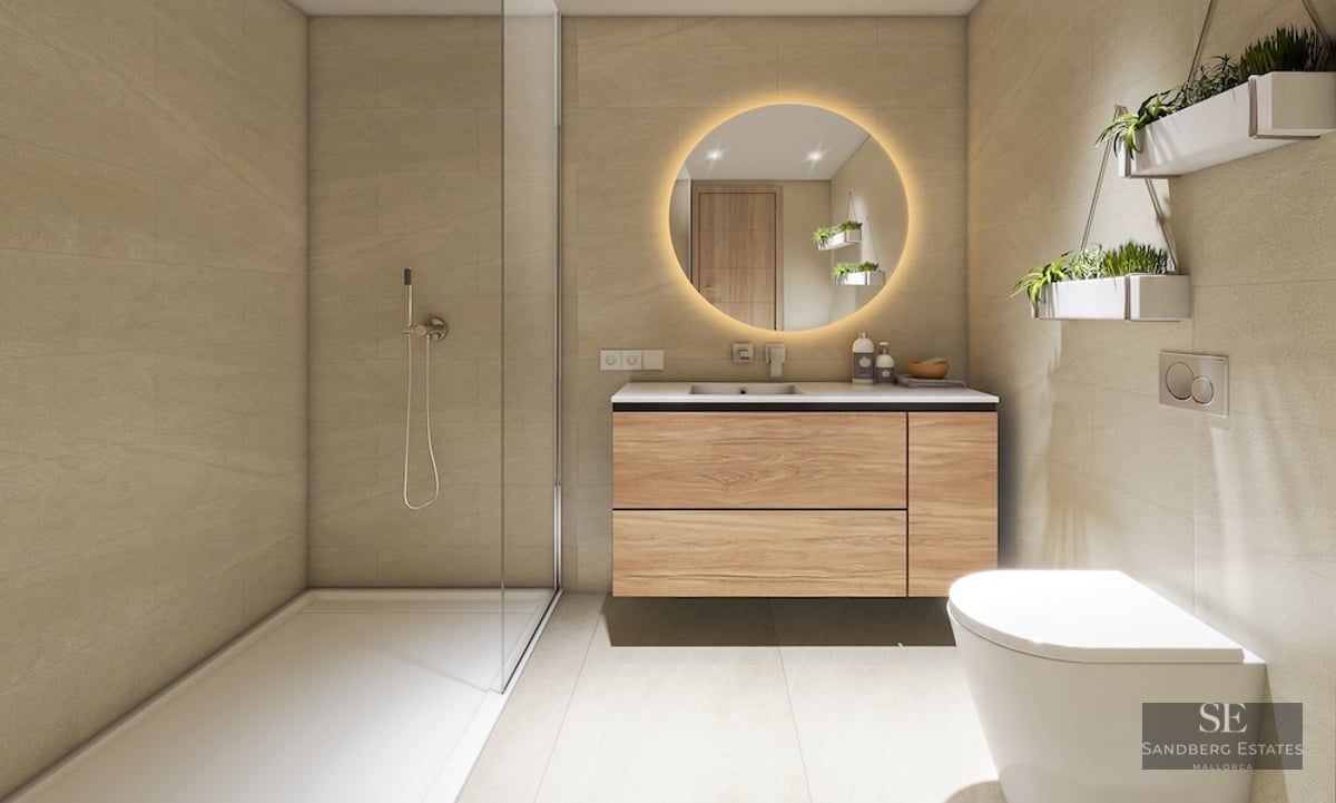 Modern bathroom with walk-in glass shower, wood vanity, backlit round mirror, and wall-mounted plants.