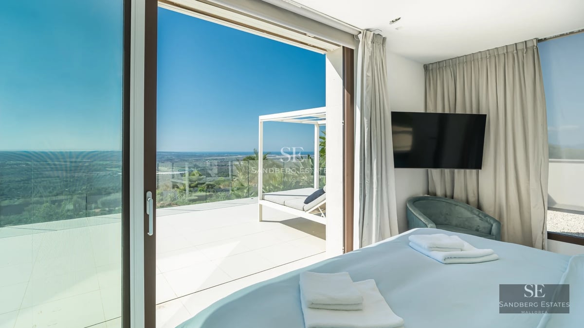 Exterior view of modern villa with infinity pool, spacious terraces, and lush garden. Minimalist architecture with panoramic windows.