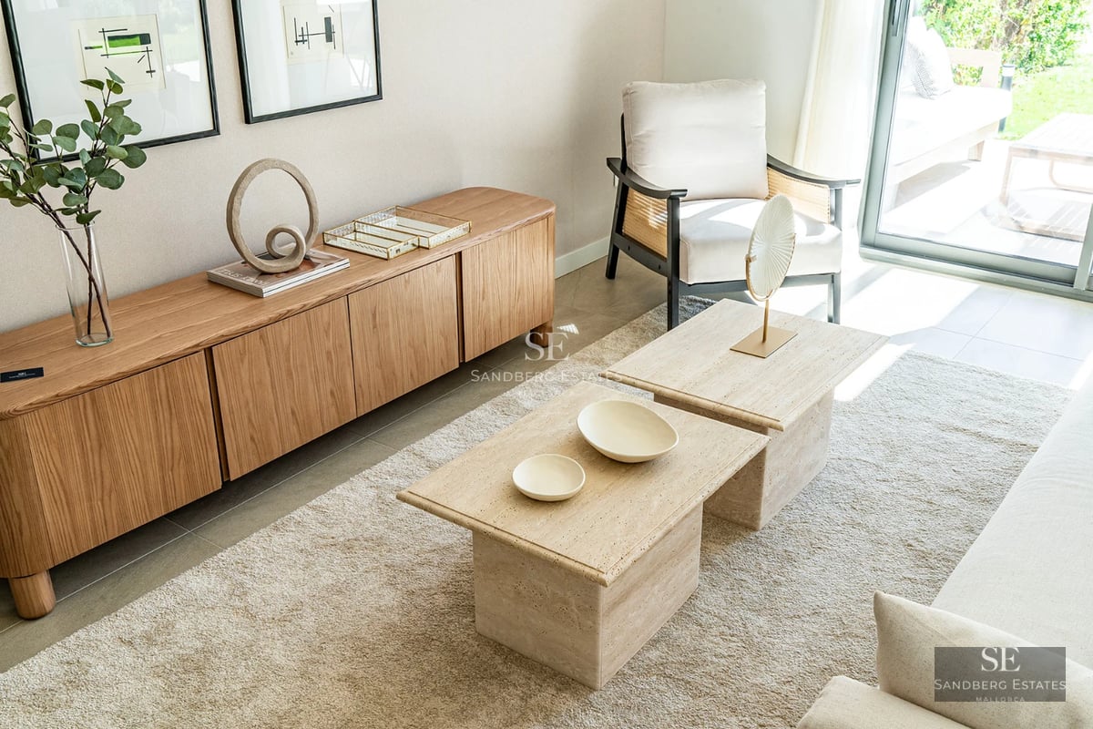 Exterior view of a modern home with a vibrant blue pool and lush garden. Minimalist architecture and large windows.