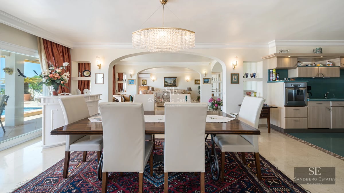 Exterior view of a modern villa with a pool, manicured garden and large terraces. Minimalist and elegant architecture.