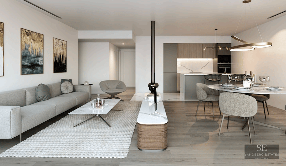 Modern open-plan living room with grey sofa, marble coffee table, and dining area with a view of a minimalist kitchen.