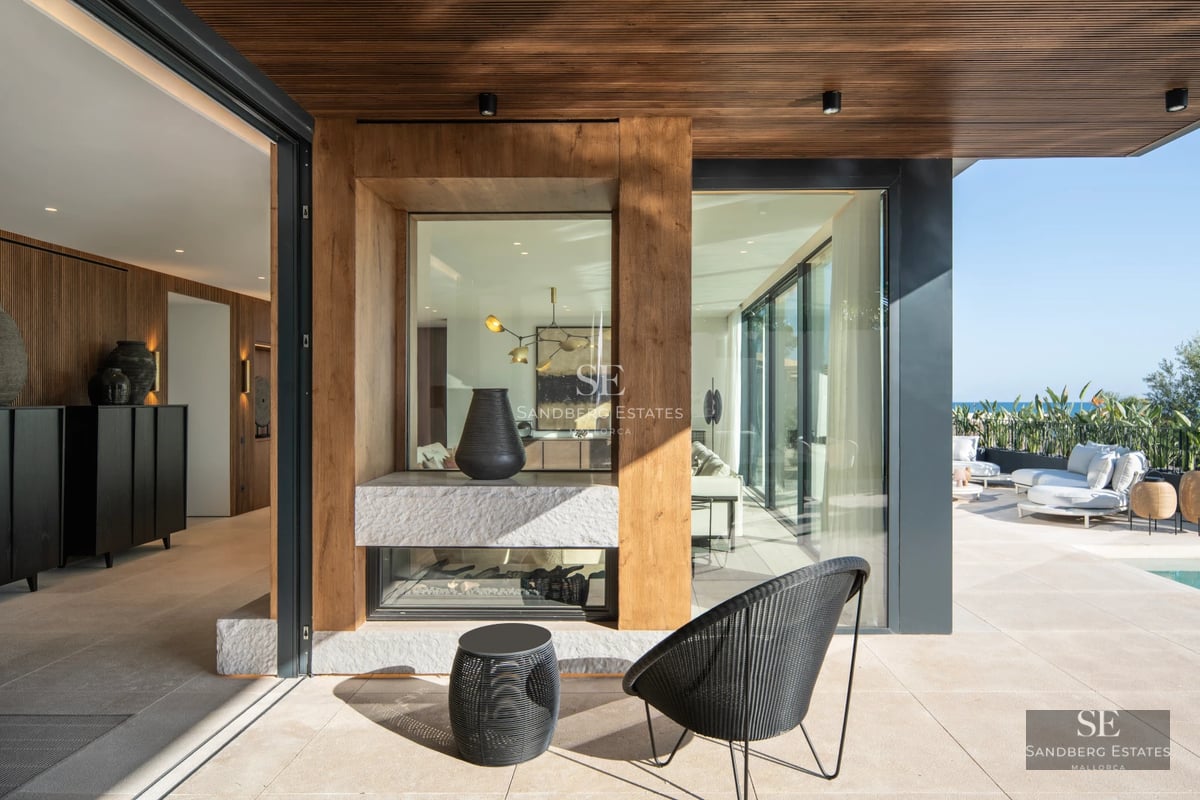 Exterior of a modern villa featuring a pool and lush garden. Elegant architecture, large windows, and manicured landscaping.