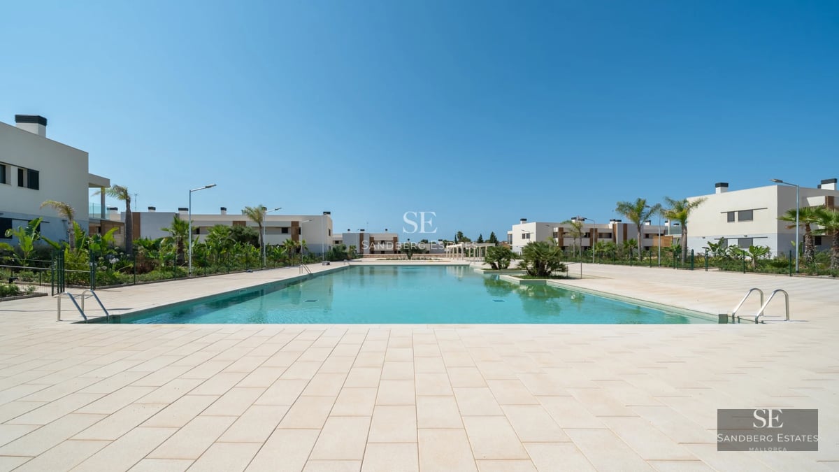 Spacious terrace with swimming pool, sun loungers, and panoramic views. Modern design with high-quality materials.