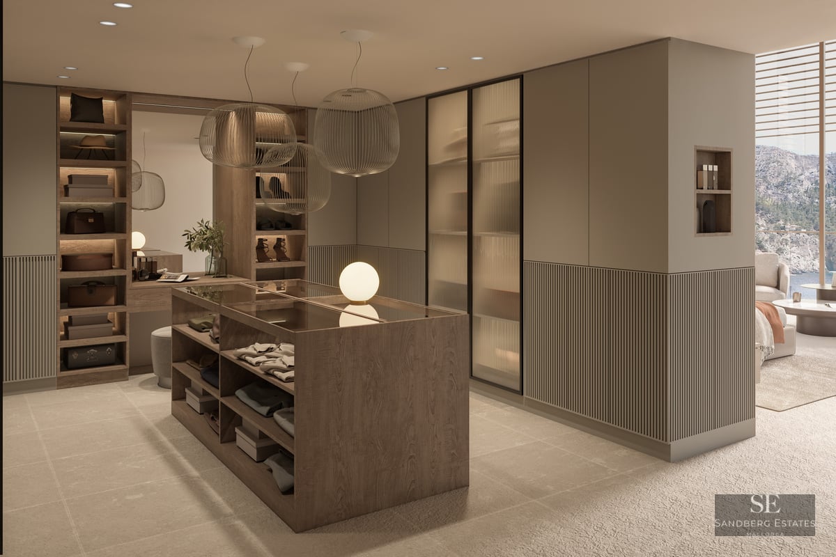 Modern dressing room featuring a central wood island, ribbed glass wardrobes, and elegant sphere pendant lights.