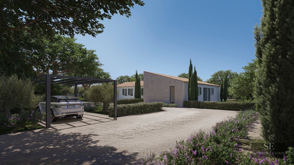 Modern Mediterranean villa with stone accents, a landscaped gravel driveway, and a luxury SUV under a black pergola.