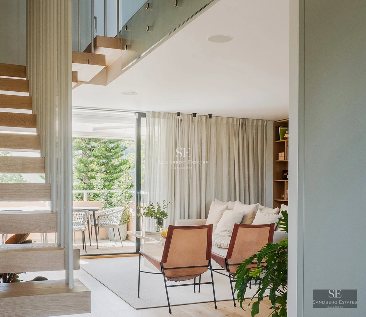 Exterior view of a modern villa featuring an infinity pool, expansive terraces, and lush garden. Contemporary architectural design.