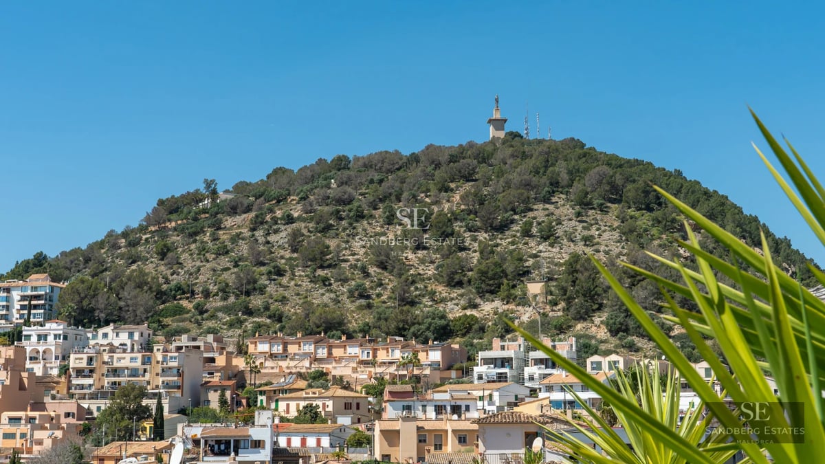View of a luxurious pool surrounded by modern architecture and lush greenery. Elegant design with ambient lighting.