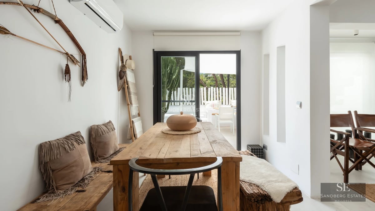 Exterior view of a luxurious villa with a swimming pool, modern architecture, large windows, and lush greenery. Minimalist design.