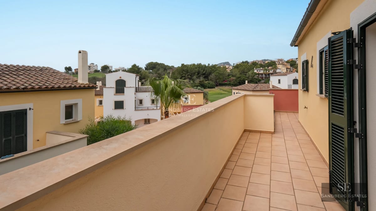 Exterior view of a modern villa featuring a pool, terrace, and spacious garden. Minimalist design with clean lines and large windows.