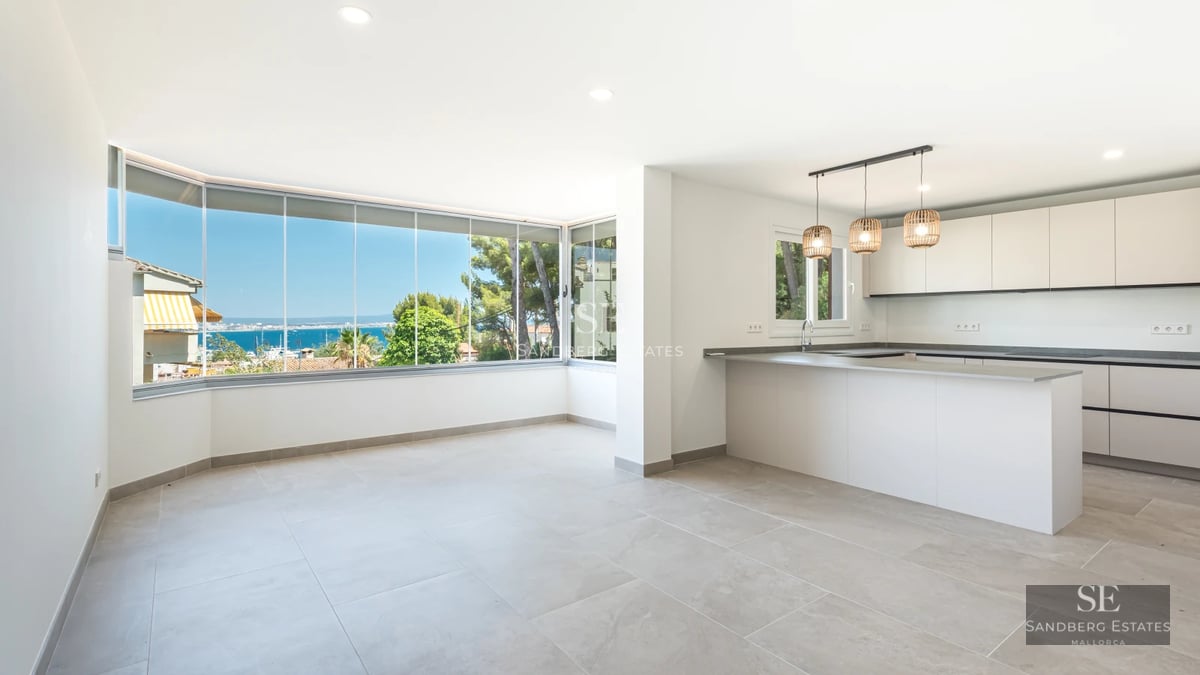Exterior view of a modern villa featuring an infinity pool, surrounded by a garden and large windows. Minimalist architecture.