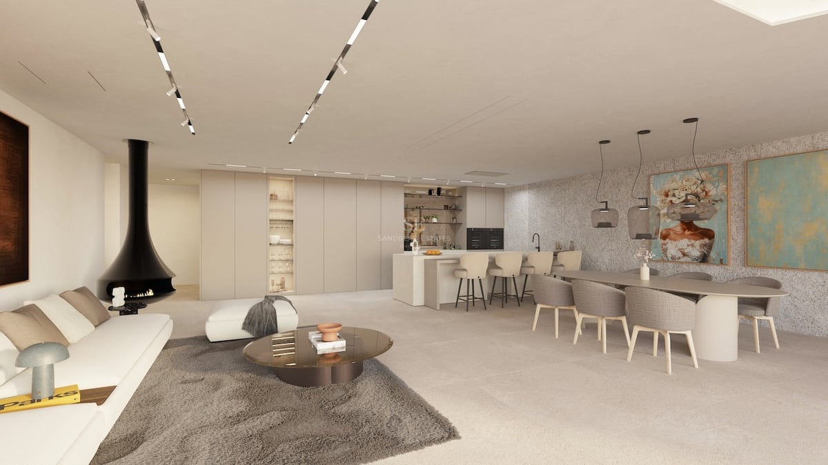 Großzügiger offener Wohnbereich mit weißem Sofa, modernem schwarzem Kamin, Essgruppe und Küche in neutralen Tönen.