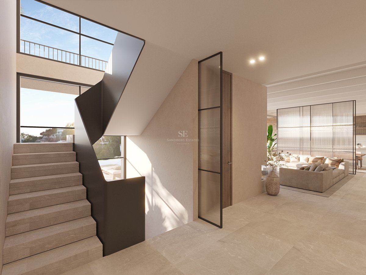 Escalier minimaliste avec marches en pierre et rampe en métal noir menant à un salon lumineux.