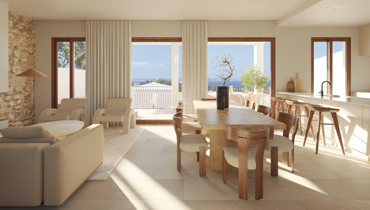 Moderner Essraum mit Holztisch und bodentiefen Fenstern, die auf eine Terrasse mit Blick auf das Meer führen.