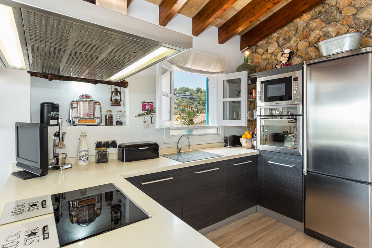 Expansive infinity pool, designer lounge chairs, and modern architecture. Lush garden and panoramic views.