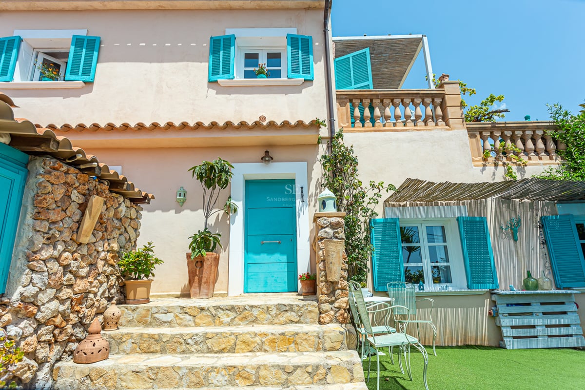 Aerial view of luxurious villa with infinity pool, landscaped garden, and modern architecture featuring clean lines and large windows.