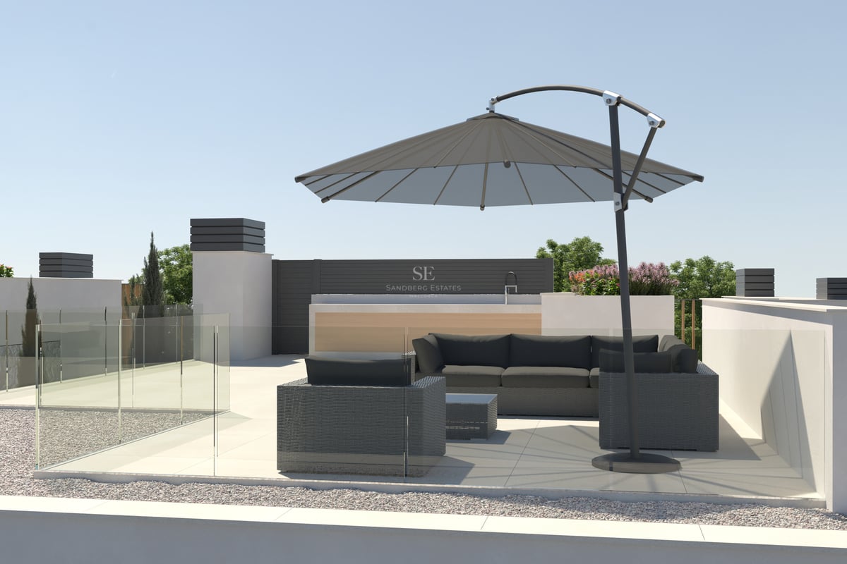 Rooftop terrace featuring charcoal grey lounge sofas, a large cantilever umbrella, and glass railings under a clear sky.