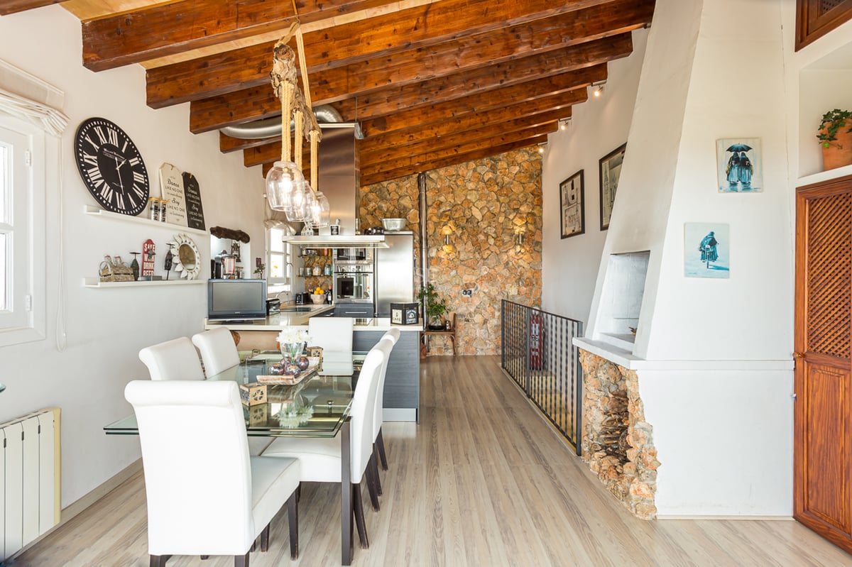 Exterior of modern villa featuring an infinity pool, lush gardens, and expansive terraces. Minimalist architectural design with large windows.