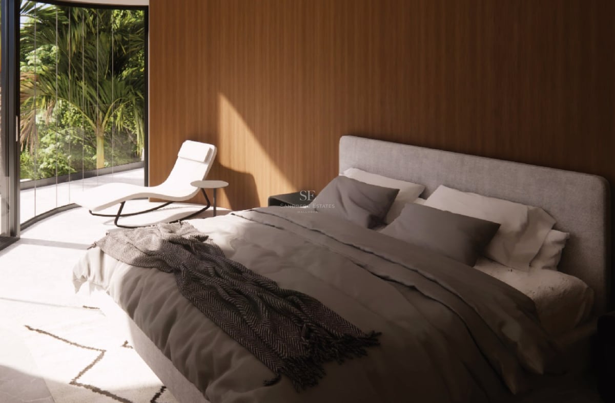 Chambre moderne avec boiseries en chêne, lit en lin gris et baie vitrée ouvrant sur une terrasse ensoleillée.