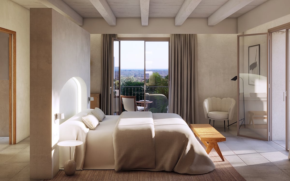 Chambre principale de style méditerranéen moderne avec poutres apparentes, terrasse privée et tons neutres.