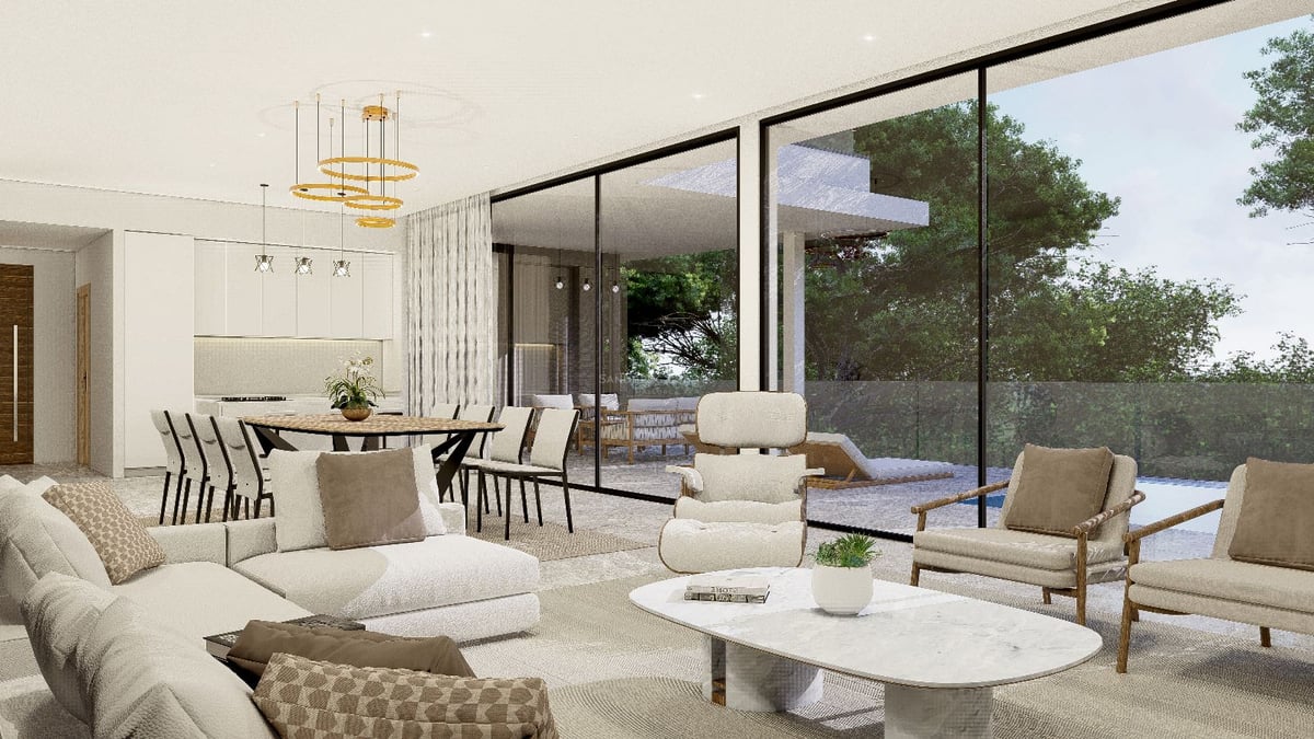 Salon moderne avec canapés crème, table en marbre et grandes baies vitrées donnant sur une terrasse avec piscine.