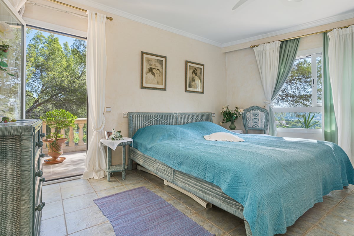 Spacious living room with panoramic windows, abundant natural light, and modern furnishings. Breathtaking sea views. Contemporary design.